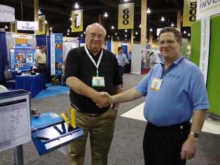 Roger Thomson, President of Conelec of Florida Inc. (left) purchasing the SMT Splicing Cart from Ken Bliss, President and Owner of Bliss Industries.