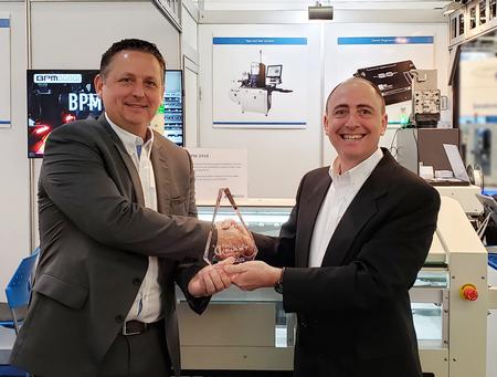 James Cawkell, Global Sales Director for the Adaptsys Group receives the Global Sales Award from James Holava, Global Account Director for BPM Microsystems at the recent SMT Connect Trade Show in Nuremberg, Germany