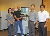 Koh Young America staff members gather in the new Training and Process laboratory at KYA’s new facility in Chandler, AZ, with General Manager Harry Yun (Second from right).