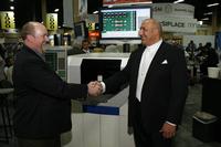 Marty Crow of Victron (left) and Brian D’Amico of MIRTEC (right) celebrating the sale of the first of multiple MIRTEC MV-7U In-Line Automated Optical Inspection (AOI) Systems to be purchased by Victron, Inc.
