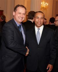 XJTAG CEO Simon Payne (left) with Deval Patrick, Governor of Massachusetts (right). Photograph by Clive Totman.